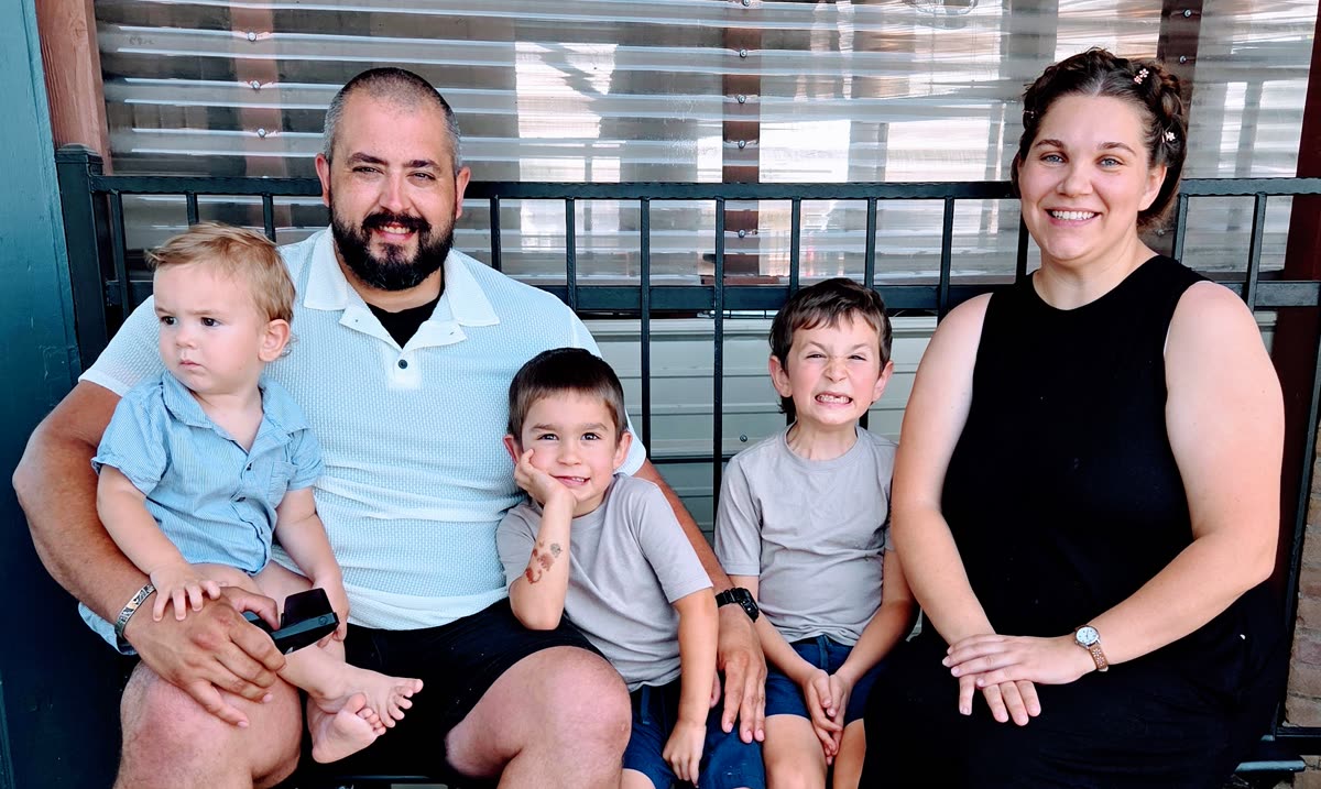 Phil and Mackenzie with their three boys